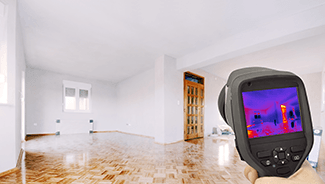 Infrared laser thermometer taking a temperature reading of various surfaces of a home