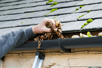 Keep your gutters clean to prevent roofing problems/damage