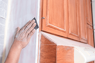 light cabinet sanding is needed to allow paint to better adhere to the surface