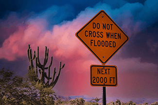 Arizona's Stupid Motorist Law was put in place for a reason. Even if you've got the biggest truck in the neighborhood, don't risk it! You never know what's under the flooding.