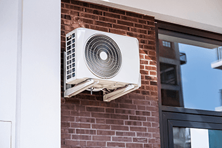 The outside unit for a ductless A/C mini split can be mounted to a wall if need be