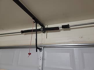 Check your garage door springs and cables for signs of damage, like tearing or fraying